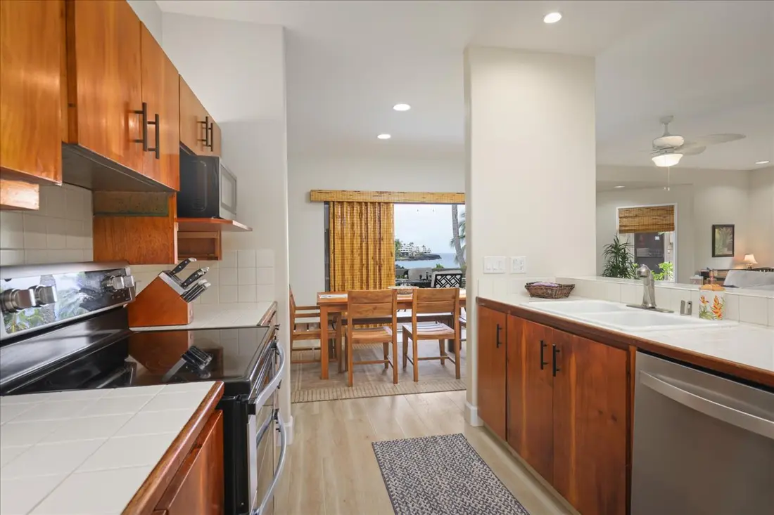 Galley kitchen opening to the dining area