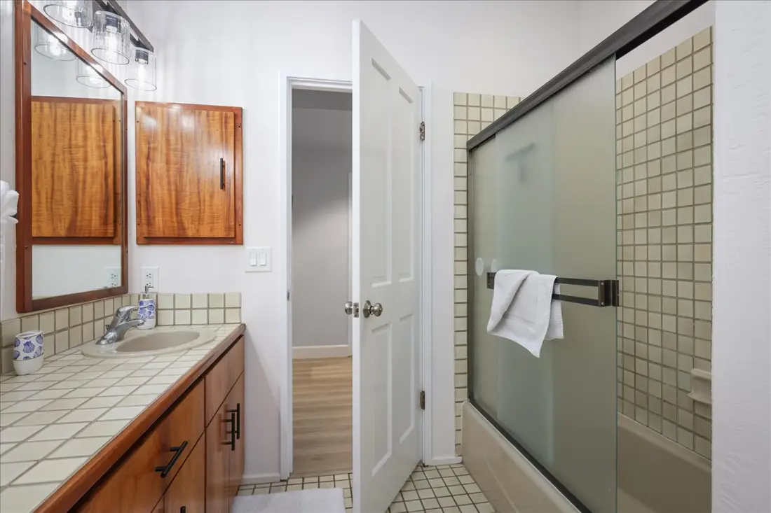 Second bathroom with tub and shower