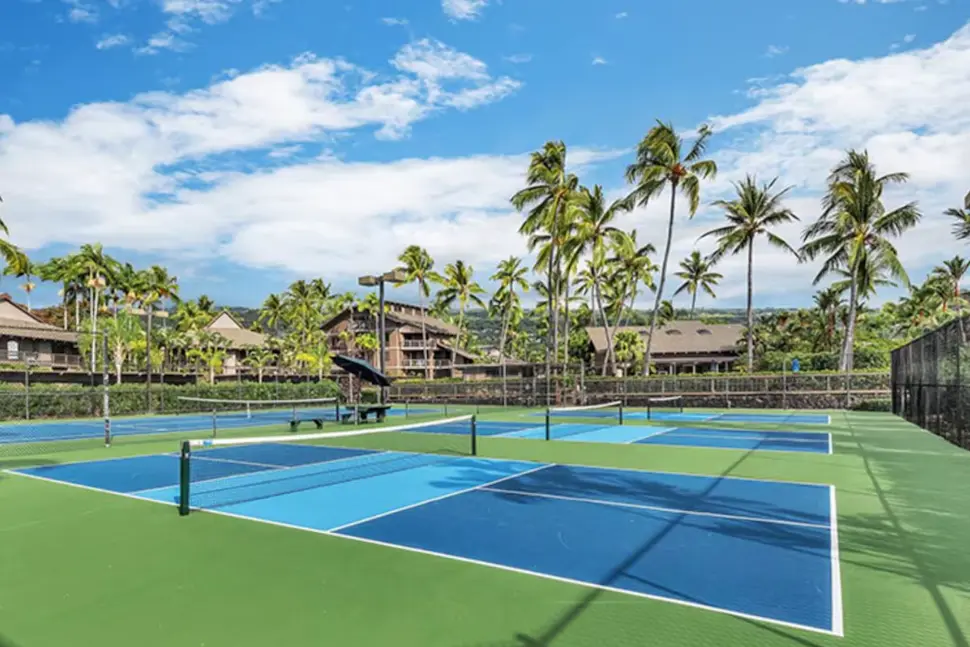 Three newly resurfaced blue and green pickleball courts