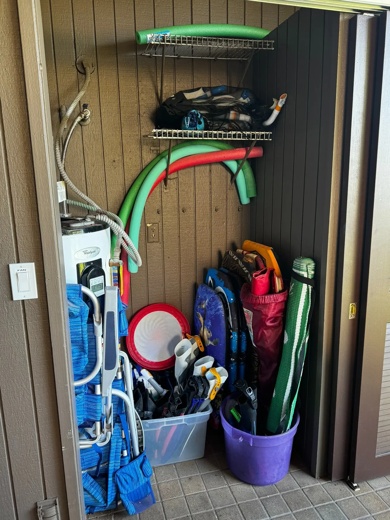 Guest beach chairs, boogie boards and snorkeling gear stored together