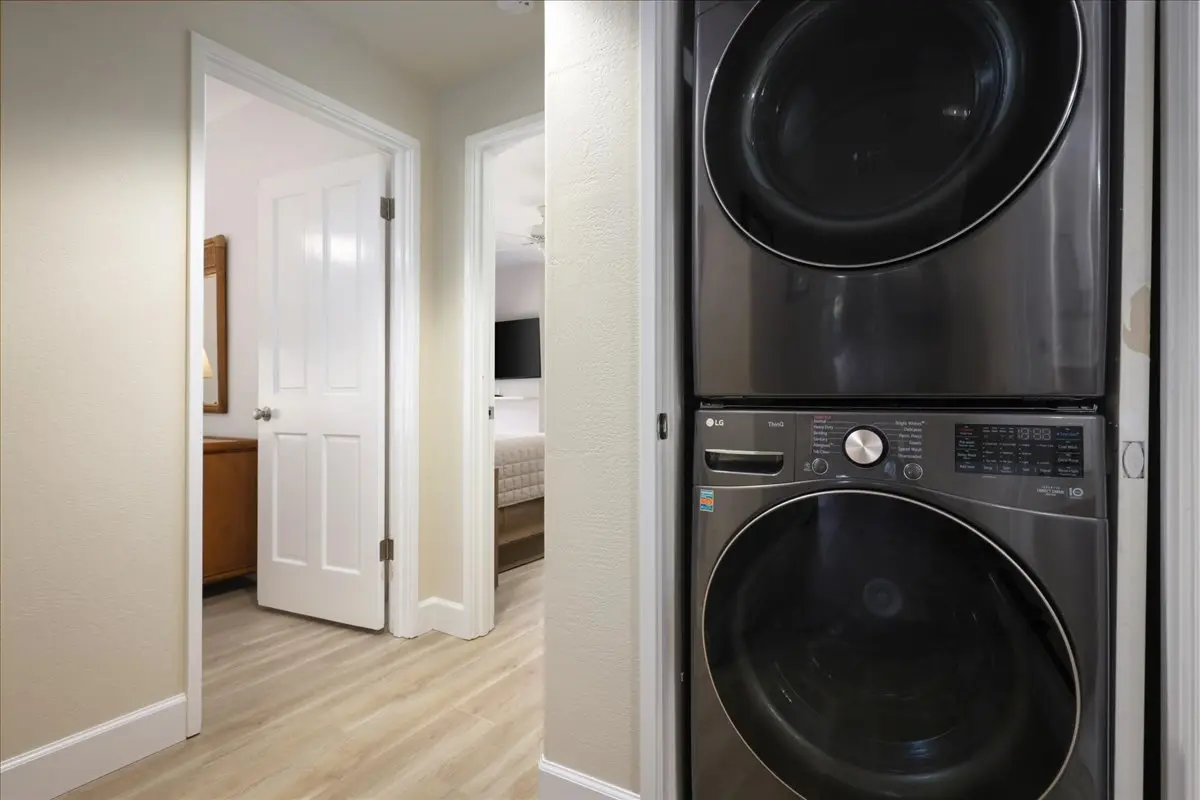 Full-size stacked washer and dryer inside the condo