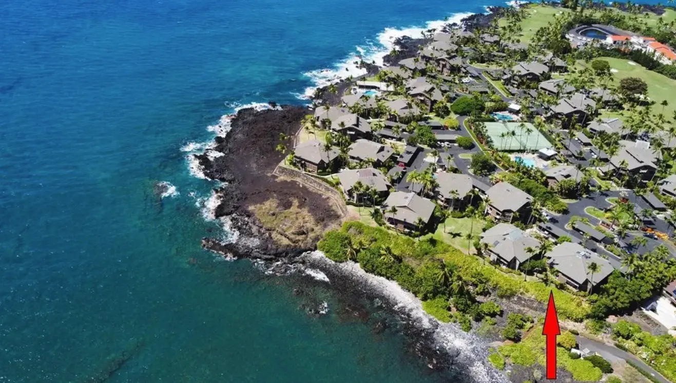 Aerial view of Kanaloa at Kona with a red arrow marking the Heʻeia Bayfront building