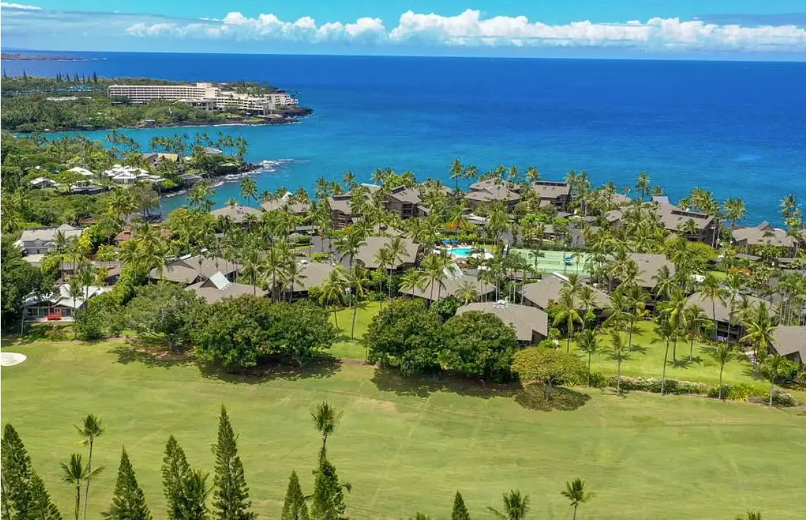 Aerial view of Kanaloa at Kona between the golf course and the Pacific Ocean